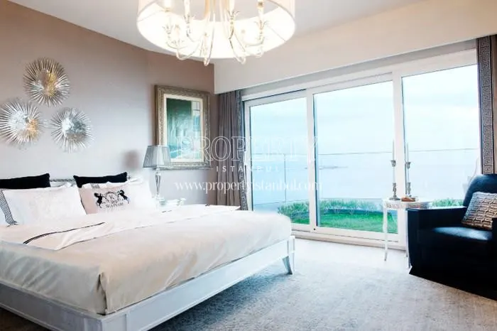 The master bedroom with a verdant balcony in