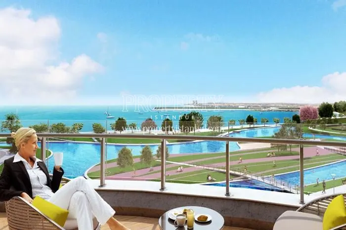 The woman drinking coffee on the balcony in Sea Pearl Atakoy