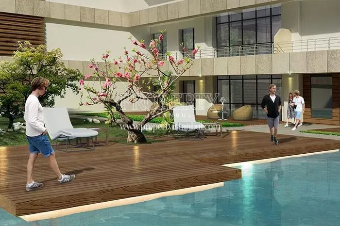The outdoor swimming pool of the 1Coastal City compound