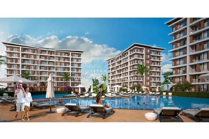 The people swimming in the compound pool