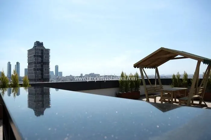 Wooden pergola on the top floor of the Adatepe Teras building