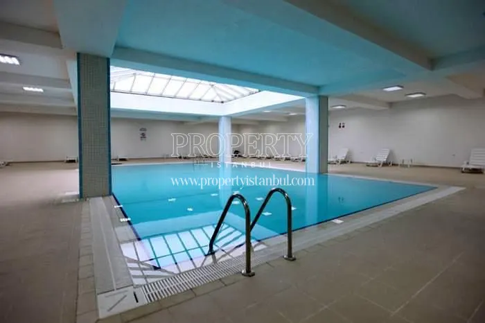 Indoor swimming pool with a glass ceiling in Agena Park