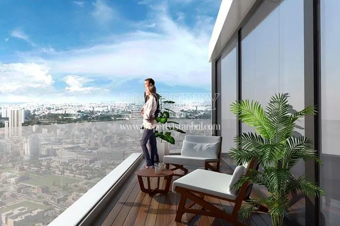 The couple viewing the city from their balcony in Airport 24
