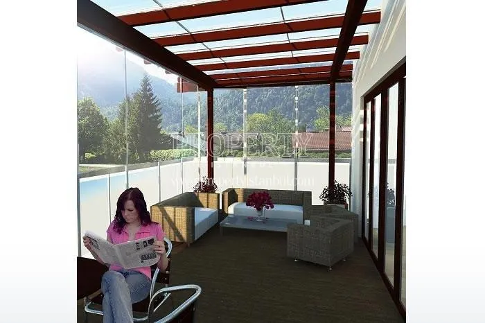 The woman reading a newspaper on their balcony in Alteras