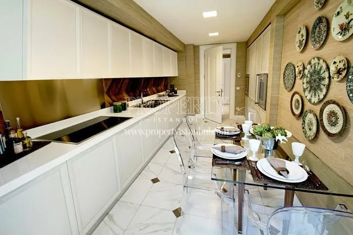 Long narrow white kitchen in Andromeda Gold Atasehir