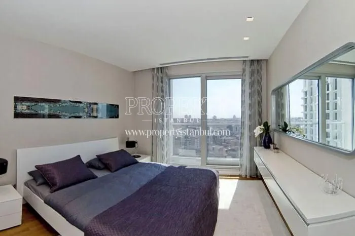 The master bedroom with a city view in Anthill Residence
