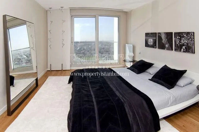The master bedroom with a city view in Anthill Residence