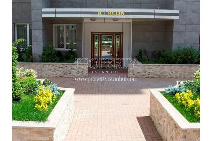 The entrance of the Aram Deluxe building