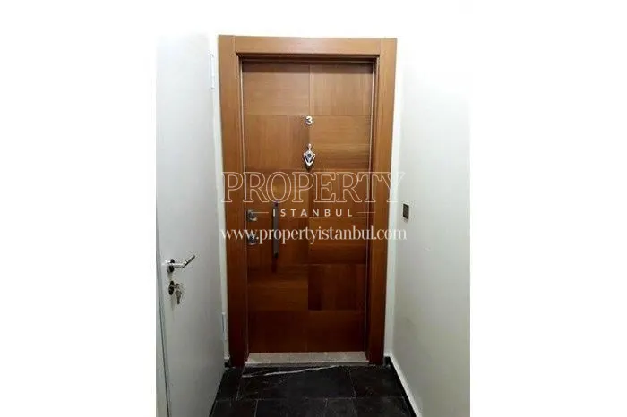 Brown apartment door in Aram Deluxe