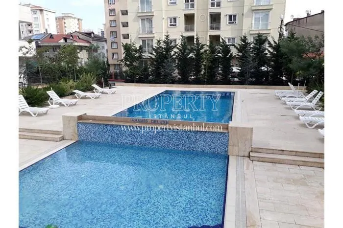 The swimming pool of the Aram Deluxe compound