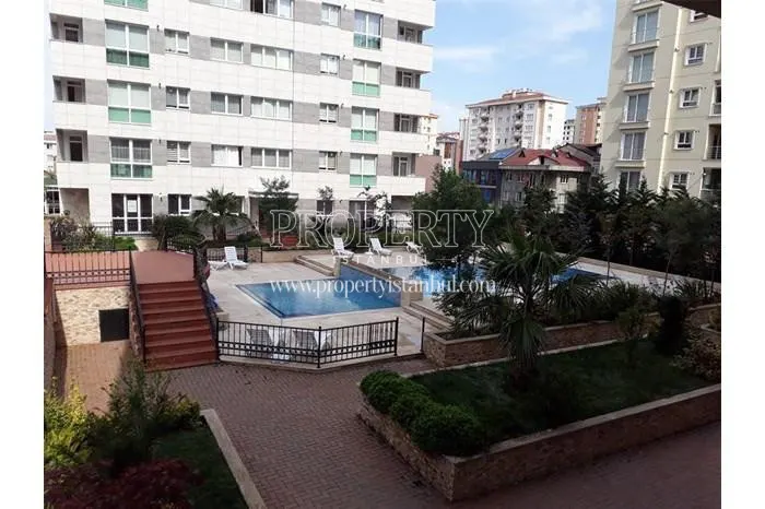 Outdoor swimming pool among the trees in Aram Deluxe