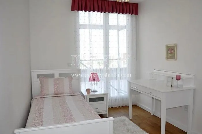 White-furnished small bedroom in Arifoglu Residence