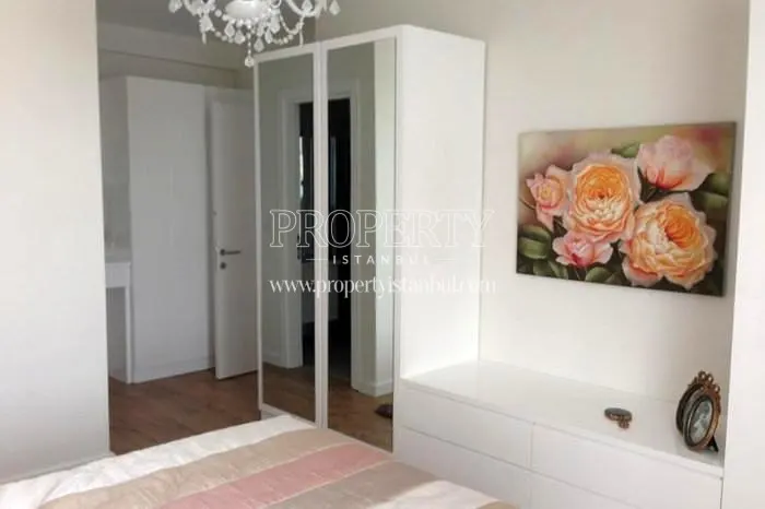 White cabinets in the bedroom in Arifoglu Residence