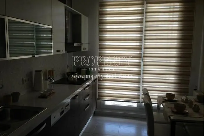 The kitchen whose curtain is closed in Arifoglu Residence