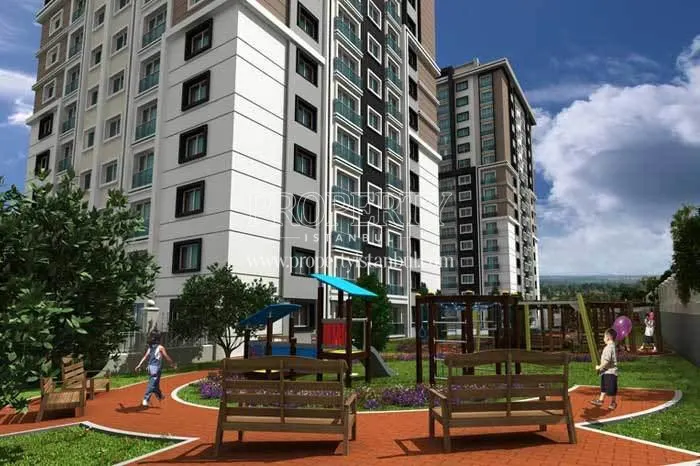 Children playing in Aris Park Residence garden