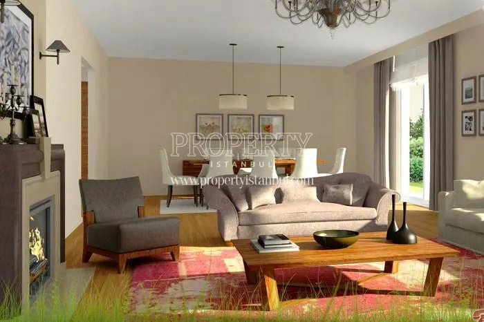 The living room with a fireplace in Asmali Evler