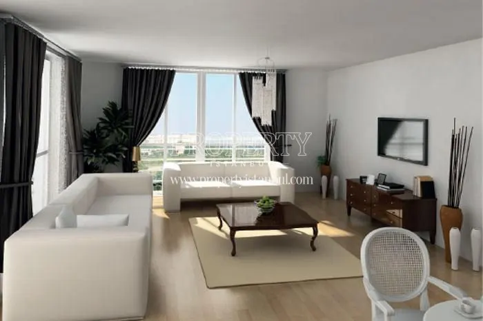 White lounge suite and black curtains in the living room in Asrin Konutlari