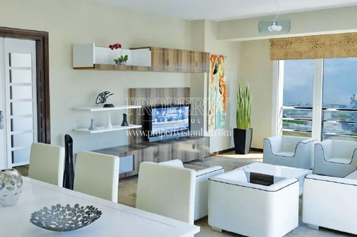 White-furnished living room in Asrin Konutlari