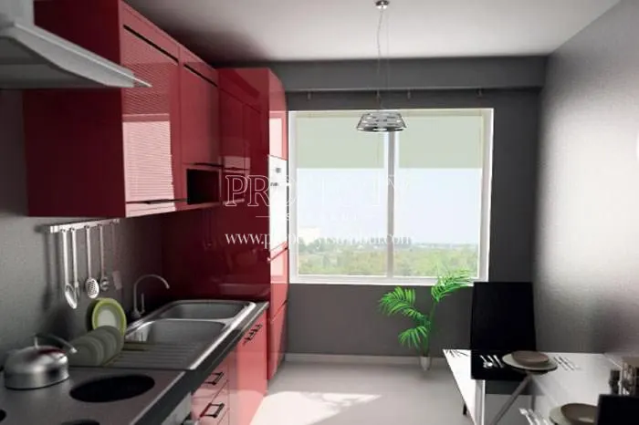 Red kitchen cabinets in one of the kitchens in Asrin Konutlari
