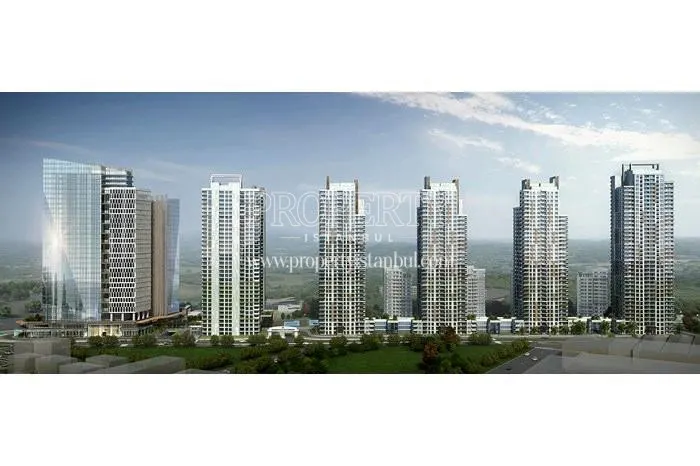 White towers in front of the residential blocks in the Avrupa Konutlari Yamanevler compound