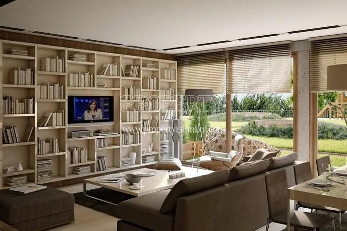 The living room with a huge bookshelf in Aya Gokturk