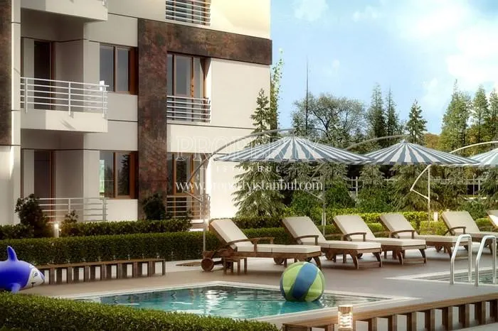 Sunbeds near the swimming pool in Aydogan Park Tuzla