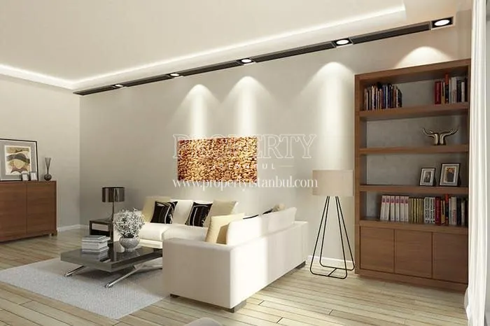 The living room with a white corner sofa in Aydos House