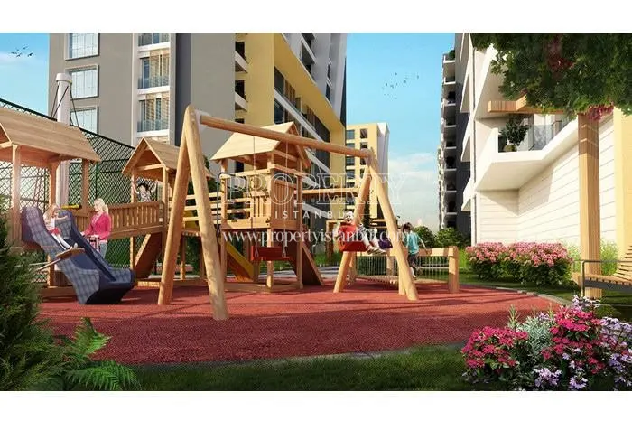 Children playing with their parents in the kids’ playground