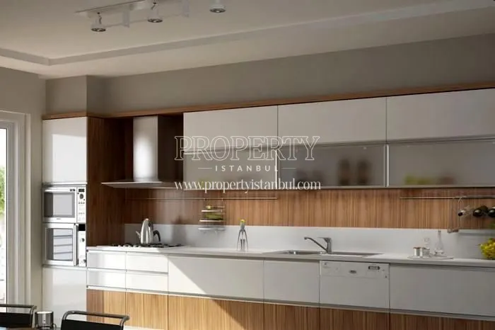 The kitchen with white and brown kitchen cabinets in Basak Vadi Konutlari
