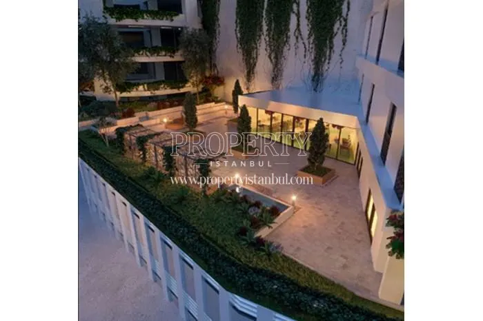 The garden of the Blox Halic 3 compound at night