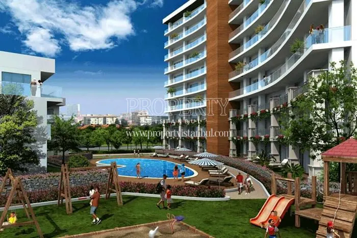 Outdoor swimming pool and kids' playground in Blue Planet