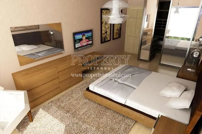 The small master bedroom with a TV in Blue Residence