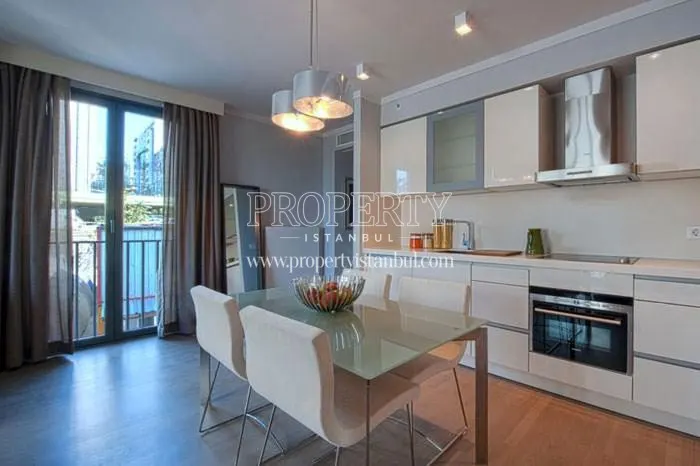 The kitchen with a small dining table in Bomonti Modern Palas