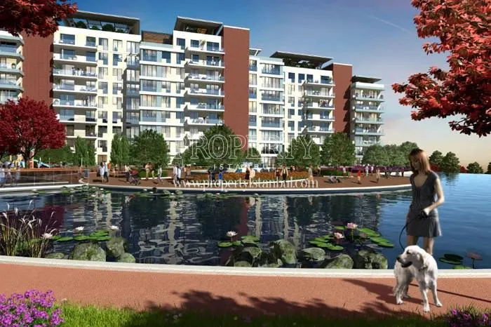 Bulvar Istanbul residents walking around the artificial lake in the compound