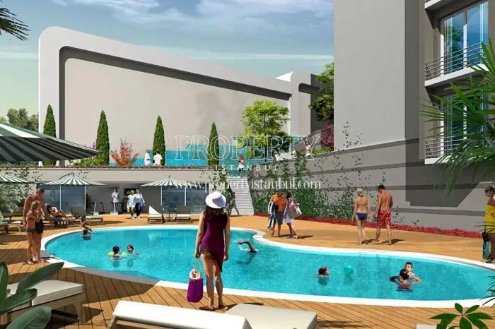 The residents swimming in the compound pool in Bura Residence