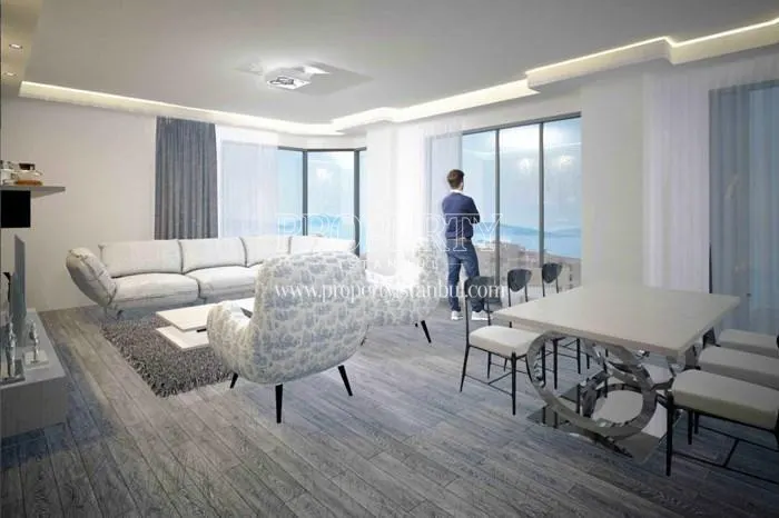 The man viewing the sea view from his living room in CT 45 Residence