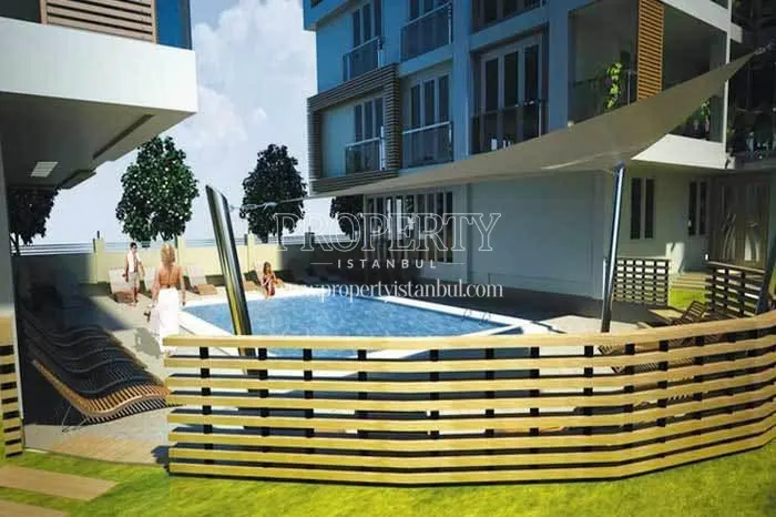 Casa Mia Tuzla residents swimming in the compound pool