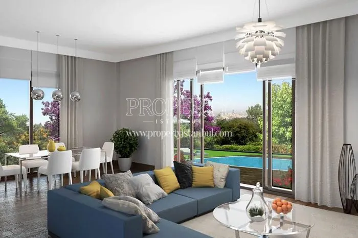 One of the living rooms with the swimming pool in Cemtas Kavakli Villalari