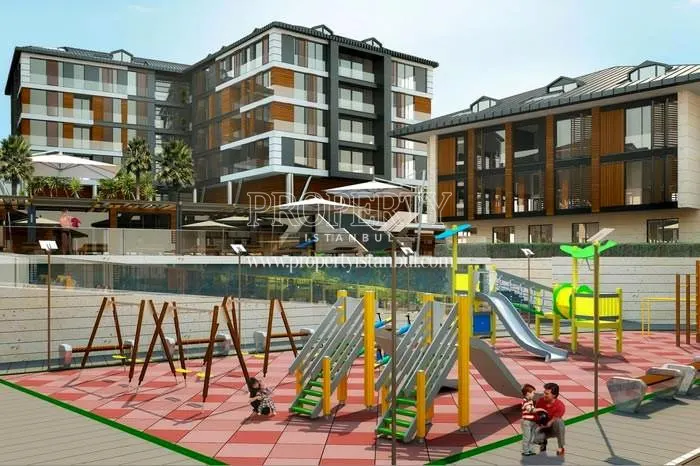 The man playing with his son in Cengelkoy Life's playground