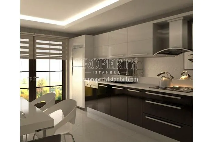 Black kitchen cabinets in one of the kitchens in Cetsa Park Evleri