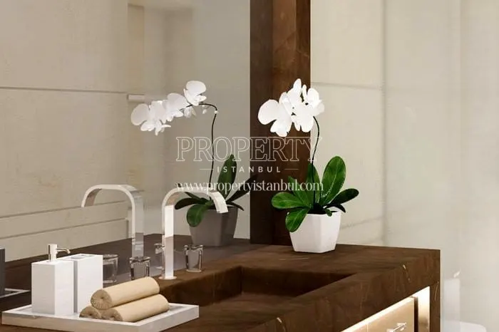 The washroom with a brown marble sink in Ciftci Towers