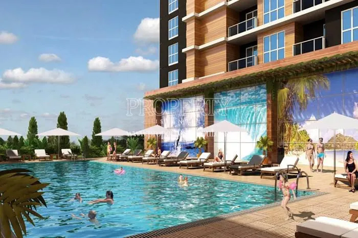 Crown Deluxe residents swimming in the compound pool