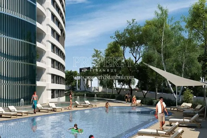 Deluxia Dragos residents swimming in the compound pool
