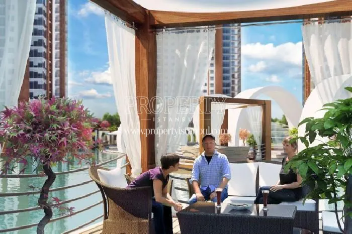 The family sitting in the wooden pergola in the Demir Romance compound