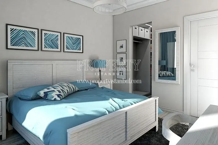 Bedroom with blue walls in Double Flats