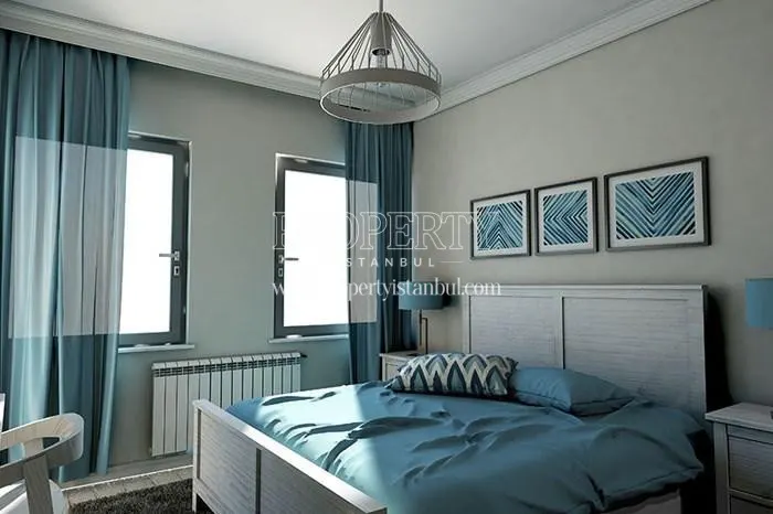 White and light blue furnished bedroom in Double Flats