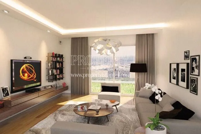 Small living room with white sofas in Double Park Residence