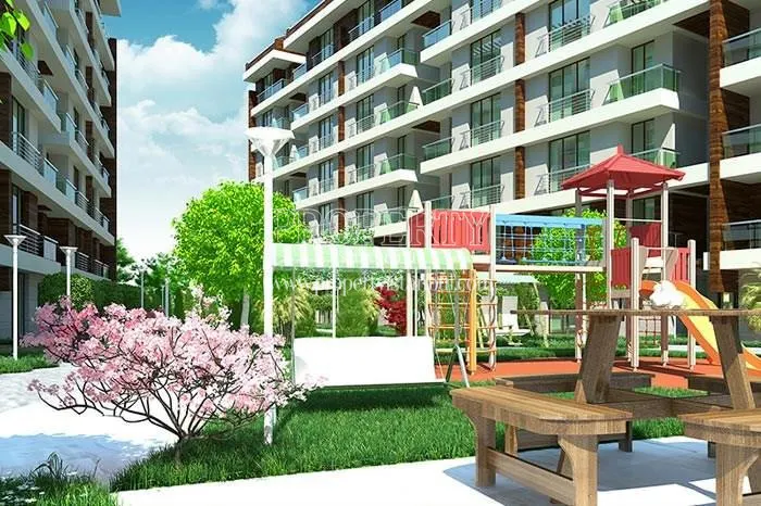 Playground for children and wooden bench in Dreamlife Konutlari Cekmekoy