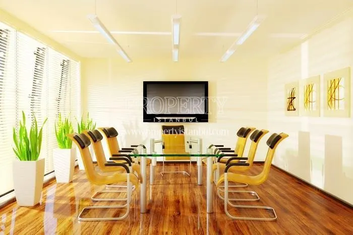 Yellow chairs around the meeting table in the Dumankaya Flex Office Bahcesehir meeting room