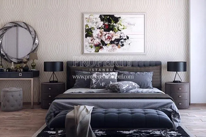 Black bed in one of the bedrooms of the Edonia Garden apartments